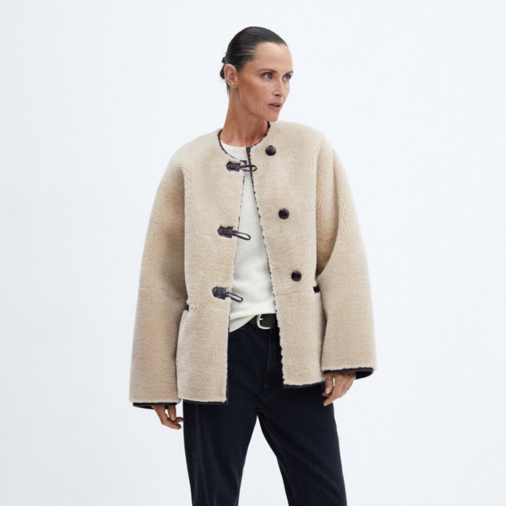 Fur-effect coat with appliqués